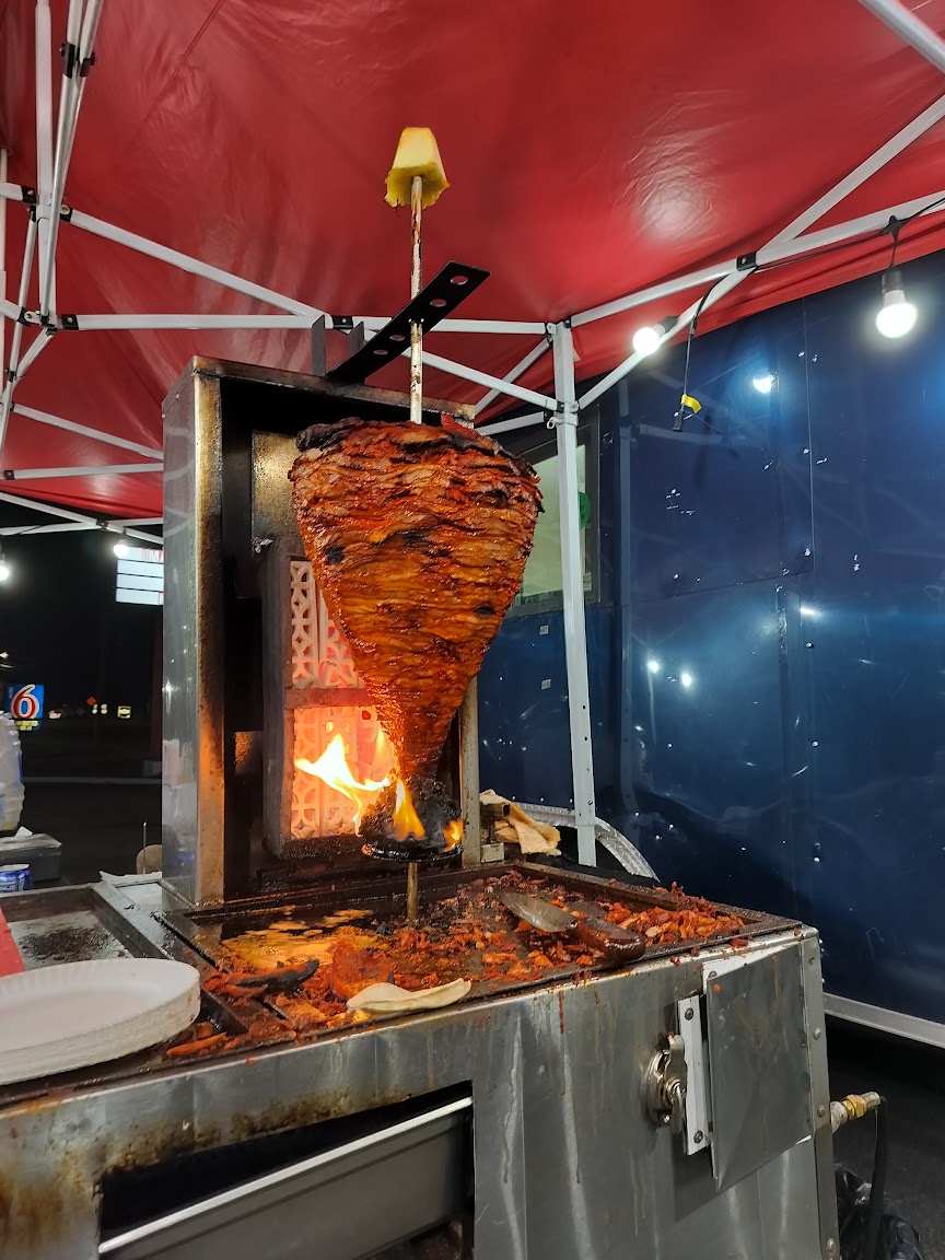 Trompo al pastor over open flame at Tacos Los Mas Buscados